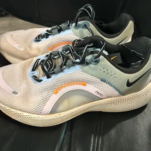 Nike React Sneakers in Black, White, and Orange Running shoes thumbnail 1