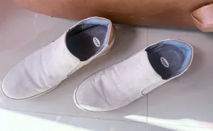 Dr. Scholl's "If Only" wedge slip-on sneakers in a light gray perforated suede material. thumbnail 1