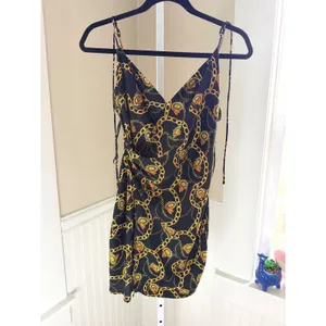 ASTR the Label Chain Print Faux Wrap Mini Dress XS Black Gold V Neck thumbnail 2