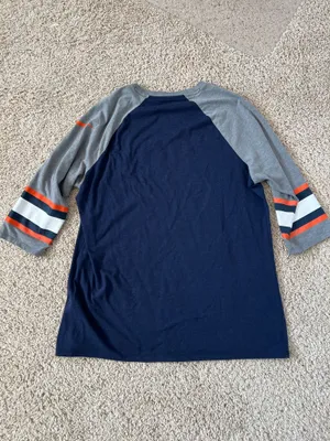 Denver Broncos logo on the chest. Navy body with gray raglan sleeves. Orange and white stripe accents on sleeves. Lightweight fan tee for game days. Nike. Size XL thumbnail 4