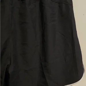 Nike Women's Black Athletic Mesh Shorts with White Trim thumbnail 7