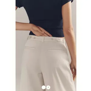 By Anthropologie Low-Rise Pleated Wide-Leg Trousers thumbnail 6