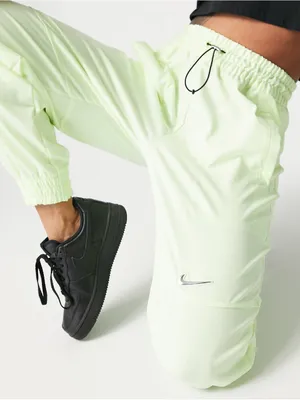 Nike Women's Sportswear Woven Pants in a bright neon green/yellow XS thumbnail 2