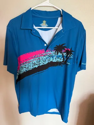 Chubbies Men's Polo Shirt Small Blue Pink Stripe Palm Tree Like New Description: Upgrade your vacation or golf wardrobe with this men's Chubbies performance polo shirt in a vibrant blue. It features an eye-catching neon pink and black abstract stripe with graphic palm trees across the chest, perfect for tropical vibes. it is a men's size small and crafted with premium stretch fabric. This shirt is in excellent, like-new condition with no flaws, fading, or signs of wear Perfect for summer outings, golf days, or casual wear. Ships fast from a smoke-free home! thumbnail 1