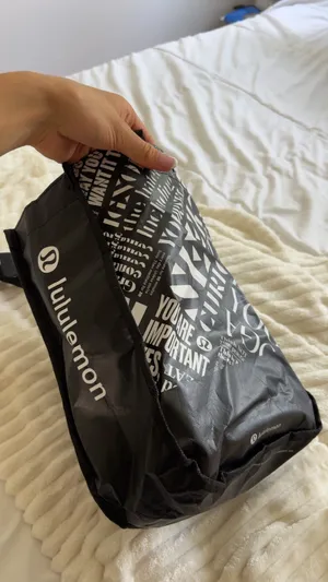 Lululemon black tote bag with white text graphics thumbnail 3