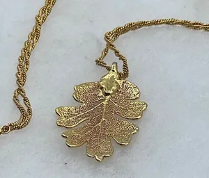 Vintage gold tone oak leaf pendant and 25” approximately chain. thumbnail 1