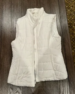 Aeropostale Stay warm and stylish with this sleek white puffer vest. Perfect for layering in cooler weather. thumbnail 1