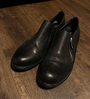 BCBGeneration Women’s Black Leather Slip-On Shoes with Side Zipper thumbnail 1