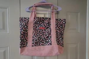 Mia and Tess candy cane and snowflake Christmas tote in black, red and white. thumbnail 5