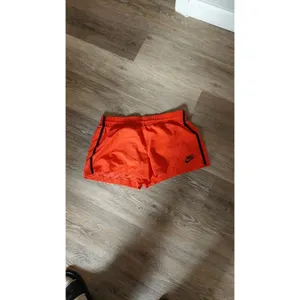 Nike Womens Orange Athletic Shorts With Black Stripe Accents - Lightweight thumbnail 2