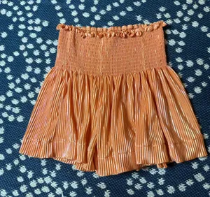 orange metallic pleated swing shorts by Queen of Sparkles youth size xl thumbnail 1