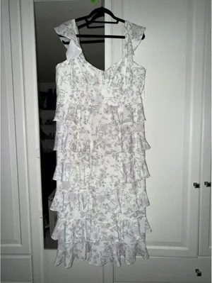 Eloquii bridal dress features a corseted bodice and tiered ruffled skirt. thumbnail 2