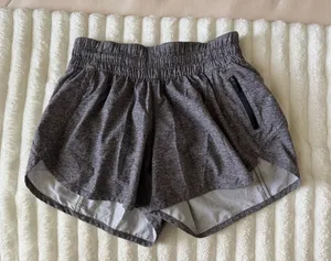 lululemon athletica Heathered Charcoal Athletic Shorts with Zipper Pocket 4” thumbnail 1
