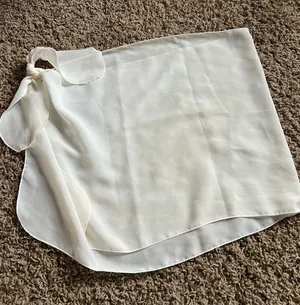Dottie Couture white mini coverup skirt with tie detail #skirt #feminine thumbnail 1