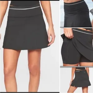 Athleta Ace Black Tennis Skort with silver reflective stripe on waistband thumbnail 2