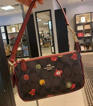 NWT Coach Nolita 19 In Signature Canvas wristlet With Ornament Print‎ thumbnail 1