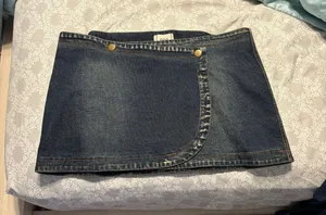 Urban Outfitters mini asymmetrical denim skirt with button closure thumbnail 1