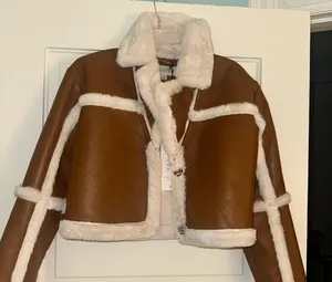 B. Coature size medium brown and white thumbnail 1