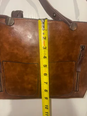 dark brown faux leather multi-pocket tote handbag featuring dual top handles and vertical front zipper pockets thumbnail 7