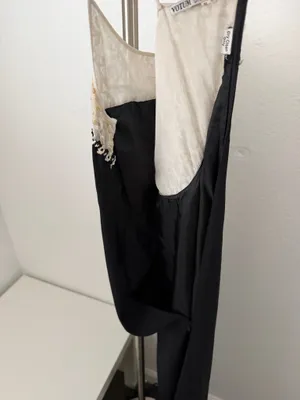 Elegant black maxi dress featuring a delicate cream lace yoke and thin straps. thumbnail 4