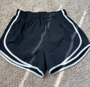 Nike Black Women's Athletic Shorts with White Piping thumbnail 1