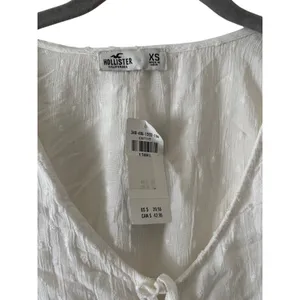 NWT Hollister Women’s White Swiss Dot Tie Front Peplum Blouse Long Sleeve XS thumbnail 6