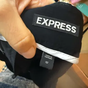 Express Y2K Black Sheen Belted Low Rise Belted Shorts thumbnail 5