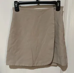 Abercrombie & Fitch tan asymmetrical wrap front mini skirt thumbnail 1
