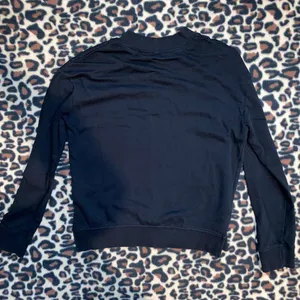 Divided “laugh more” sweater thumbnail 6