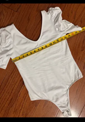 Vylette White bodysuit with Puffy Sleeves - Size Medium. ***refer to measurements. Super Cute top gentle worn and in excellent condition. Cotton/ spandex material. Measurements approximately for the bodysuit/ 14” from armpit to armpit x 25” from shoulder to snaps in crotch. Non-smoking home. Priced to sell at as is condition. Don’t like my price please make reasonable offer. thumbnail 6