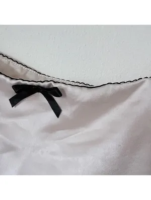 Elegant Cream Satin Camisole Top with Black Bow Accent thumbnail 3