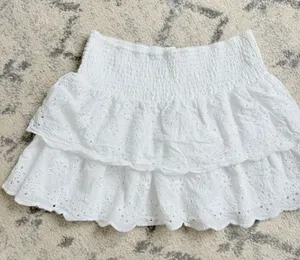 Tiered White Eyelet A-Line Mini Skirt with Smocked Waist thumbnail 1