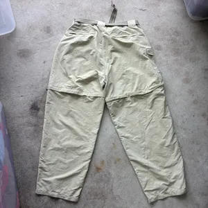 L.L. Bean convertible cargo hiking pants feature a built-in webbed belt and zip-off lower legs. thumbnail 6