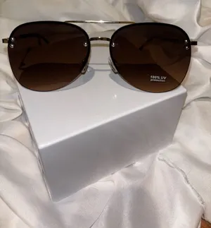 Ashley Stewart Rimless Aviator Sunglasses in Brown thumbnail 1
