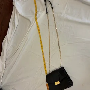 Elegant Black Leather Bag with Gold Accents thumbnail 11