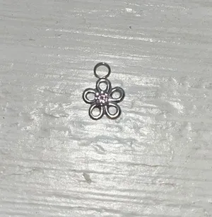Silver with pink diamond in the middle of the flower necklace charm thumbnail 1