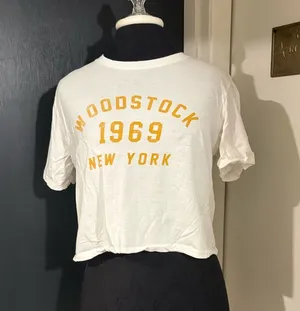 one clothing 100% Cotton White Crop Tee with Yellow Woodstock 1969 Print thumbnail 1