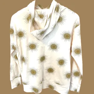 Kate Quinn Cream Hoodie with Gold Sunburst Pattern thumbnail 2