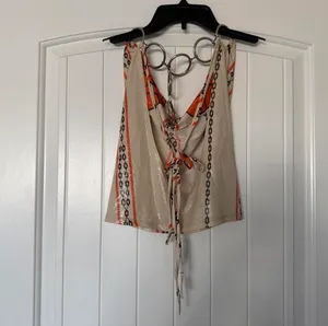 Y2K Backless Chain-Link Halter Top with Oversized O-Ring Hardware – Glossy Cream, Orange & Black thumbnail 6
