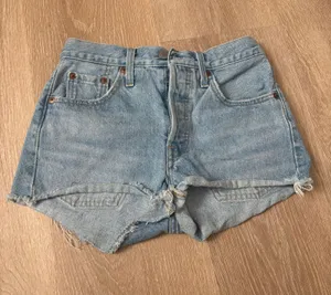 Levi’s light blue 501 distressed denim shorts thumbnail 1