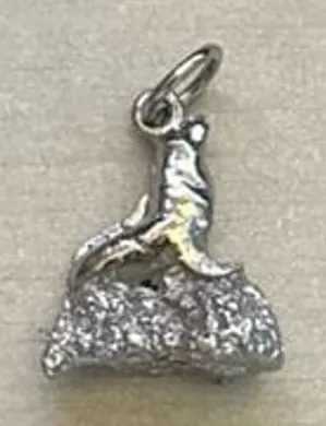 sterling silver 3D charm of a sea lion perched on a textured rock‎ 1" thumbnail 1