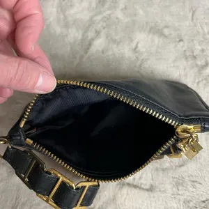 Tory Burch Black and Gold Clutch with Leather Finish and Zipper Closure thumbnail 6