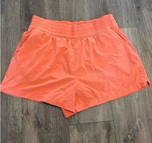 Orange Athleta High Rise Weekender Run Shorts thumbnail 1