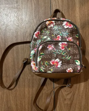 Small Nine West floral purse backpack. Minor flaw‎ on back in pictures. thumbnail 1