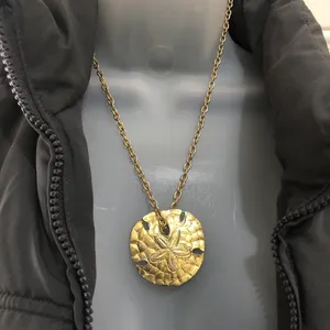 90s Unique edge streetwear Gold tone sand dollar pendant medallion necklace jewelry. thumbnail 1
