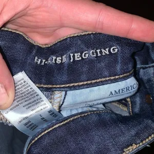 American Eagle destroyed distressed dark wash hi-rise stretchy jeggings thumbnail 3