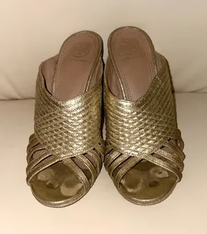 Tory Burch Brida high-heeled mules in metallic gold leather (color "Gold"). They have minor damage to the insole. Size 7 thumbnail 1