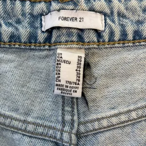 Forever 21 High-Waisted Distressed Denim Cut-Off Shorts Light Wash, Waist 33" thumbnail 4