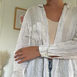 White linen button up shirt with ruffle collar and long sleeves #linen #summer thumbnail 4