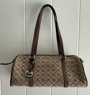 A vintage Dooney & Bourke signature jacquard barrel shoulder bag thumbnail 1